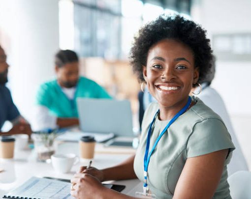 Black woman, portrait or happy doctor in meeting planning a surgery strategy or speaking of medical results in hospital. Teamwork, smile or African healthcare worker consulting, talking or working